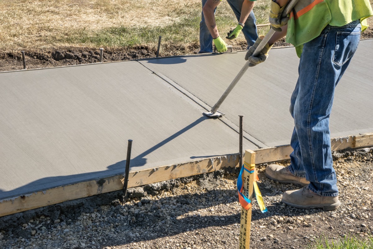 Concrete sidewalk contractors replacing a slab