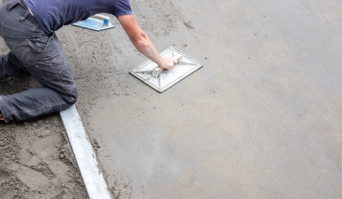 Decorative concrete contractors finishing a patio